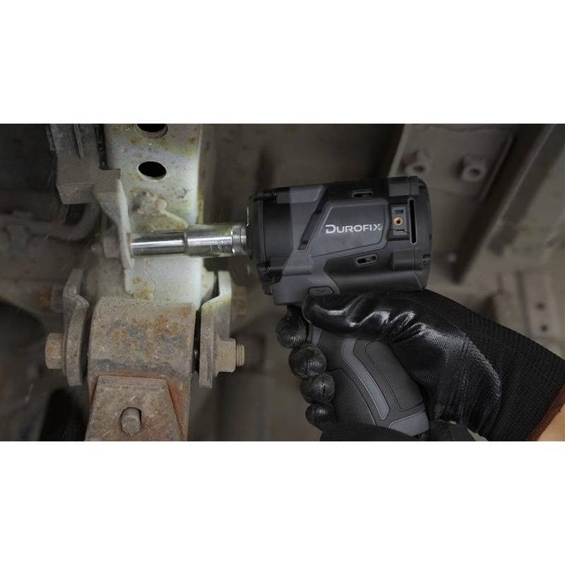 Person using a Durofix impact wrench on a mechanical component.